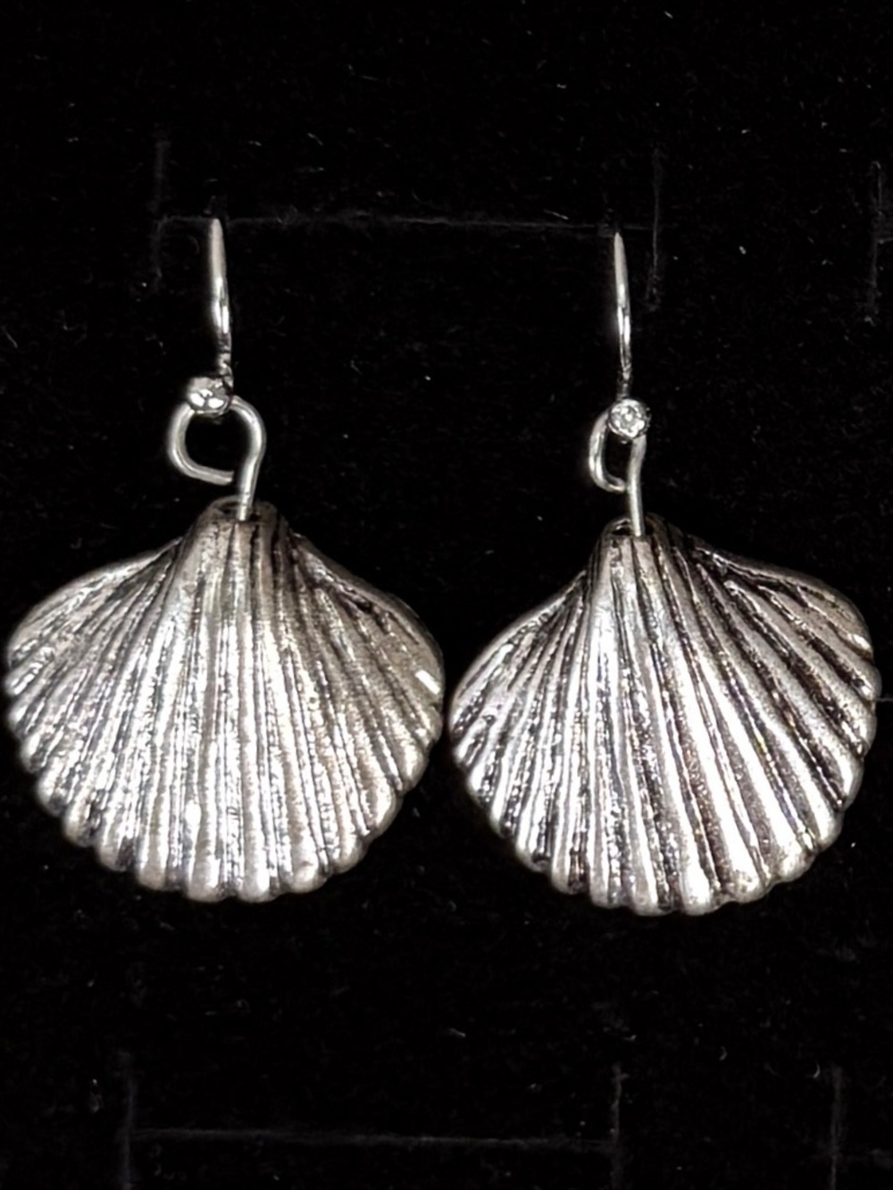 Beautiful weighted Silvertone she is chic pierced earrings